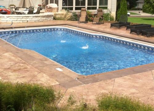 Custom double curve pool with deck jets