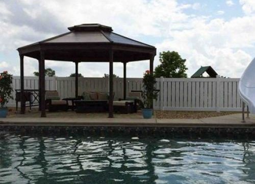 Inground pool with slide and brown liner