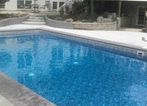 Custom built inground with stamped concrete