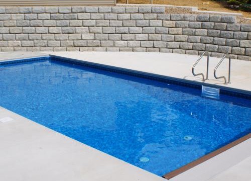 Inground pool built in sloping yard